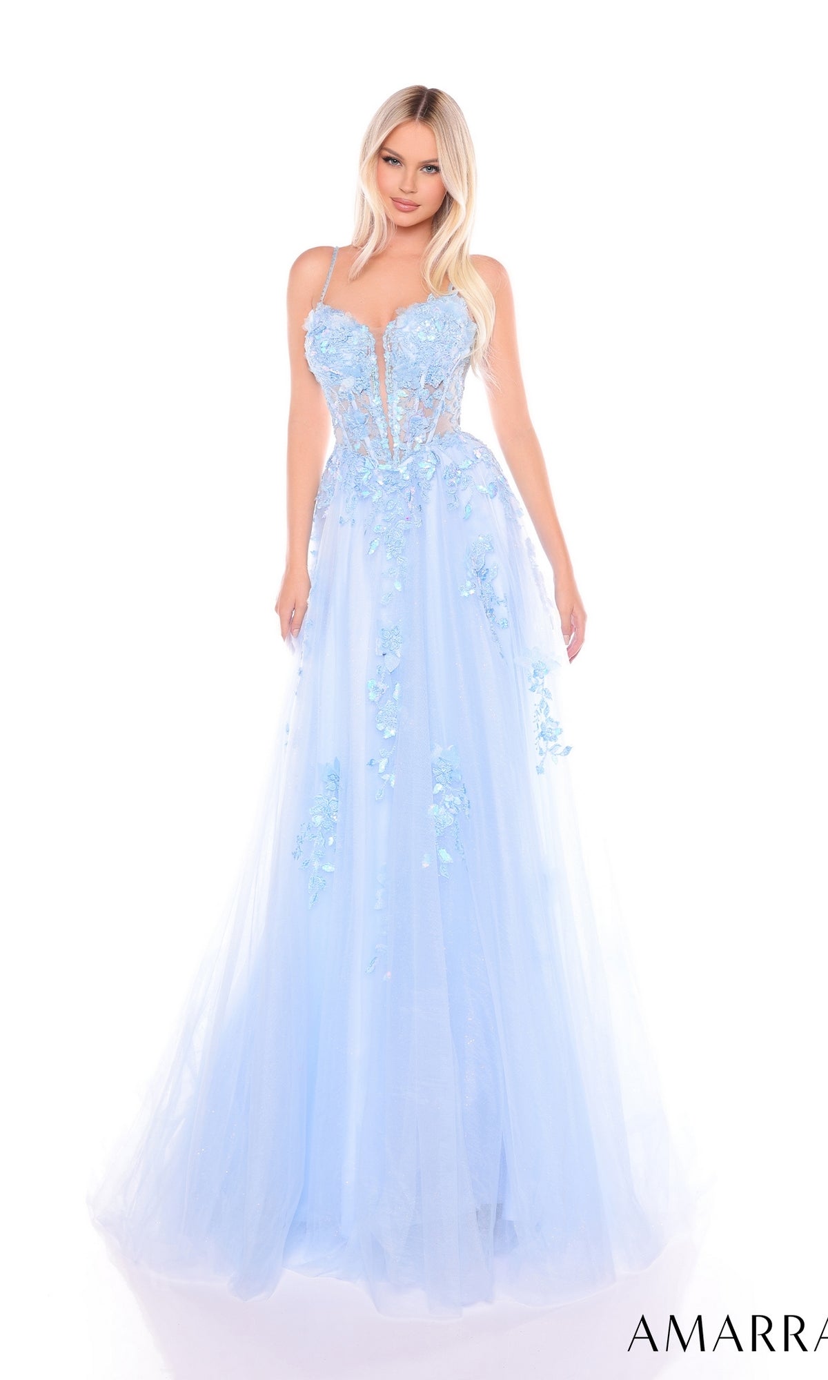 A woman stands against a white background in the Amarra 88086 long formal dress?a light blue, floor-length prom gown featuring floral appliqu‚s, lace embroidery, and a sheer corset bodice.